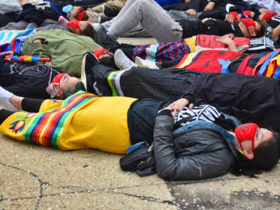 Indigenous youth held a die-in in front of the U.S. Army Corps of Engineers office in Washington, D.C. on April 1, 2021, to represent the lives lost due to environmental destruction and pipelines.