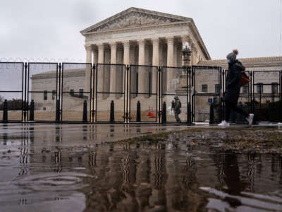 Razor wire topped fencing is seen surrounding the Supreme Court of the United States on Monday, February 22, 2021, in Washington, D.C.