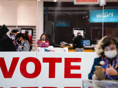 A woman casts her ballot in the 2020 general election inside the Basset Place Mall in El Paso, Texas, on November 3, 2020.