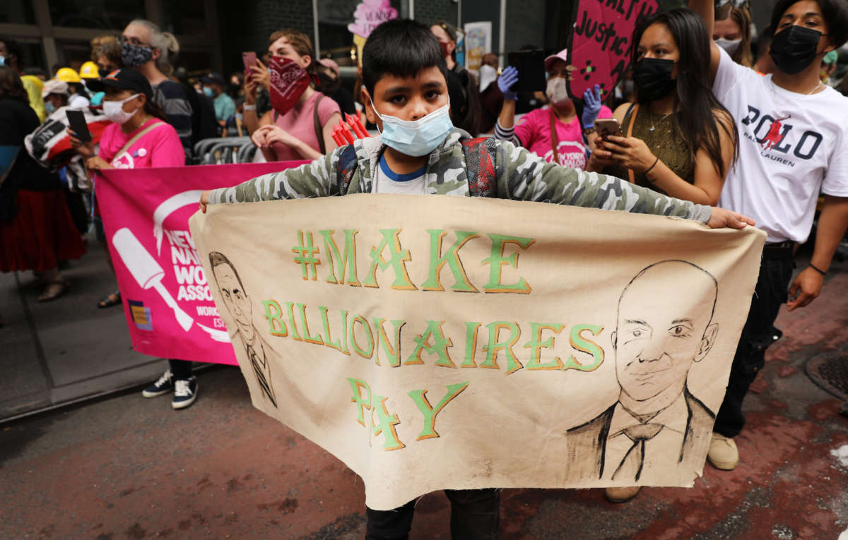 People participate in a "March on Billionaires" event on July 17, 2020, in New York City.