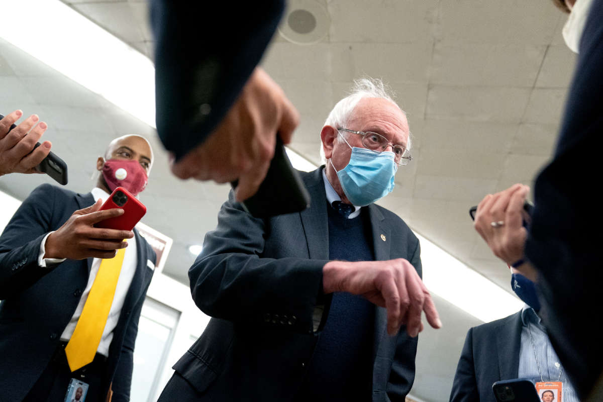 Sen. Bernie Sanders speaks to reporters in the Senate Subway during a roll call vote on April 13, 2021, in Washington, D.C.