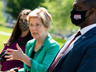 Sen. Elizabeth Warren, center, Reps. Sara Jacobs and Mondaire Jones conduct a news conference outside the Capitol to reintroduce the Universal Child Care and Early Learning Act, on April 27, 2021.