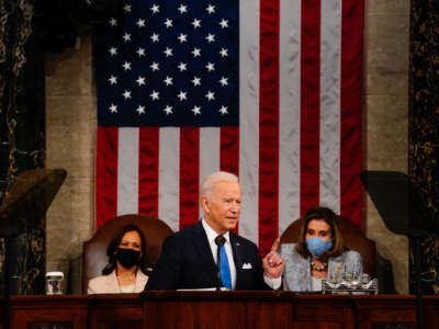 President Joe Biden addresses a joint session of Congress, with Vice President Kamala Harris and House Speaker Nancy Pelosi on the dais behind him, on April 28, 2021, in Washington, D.C.