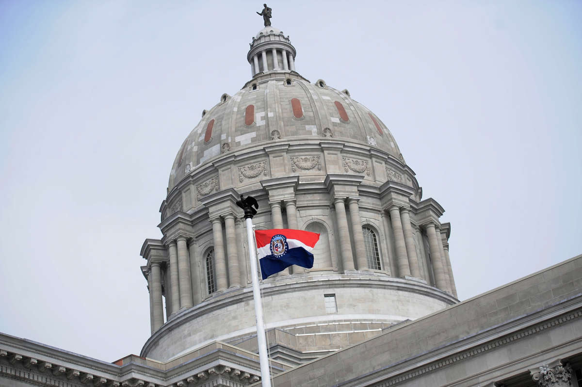 The Missouri state flag is seen flying outside the Missouri State Capitol Building on January 17, 2021, in Jefferson City, Missouri.