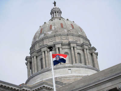 The Missouri state flag is seen flying outside the Missouri State Capitol Building on January 17, 2021, in Jefferson City, Missouri.