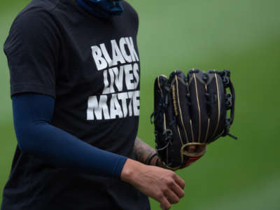 A Milwaukee Brewers player wears a Black Lives Matter shirt during warmups on August 5, 2020, at Guaranteed Rate Field in Chicago, Illinois.