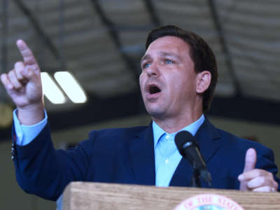 Florida Gov. Ron DeSantis responds to a question from the media at a press conference at the Eau Gallie High School aviation hangar in Melbourne, Florida, on March 22, 2021.