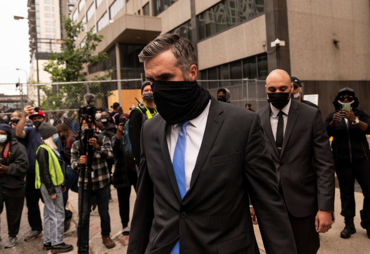 Former Minneapolis Police officers Thomas Lane, center, and J. Alexander Keung, right, leave the Hennepin County Family Justice Center after a pre-trial hearing on September 11, 2020, in Minneapolis, Minnesota.