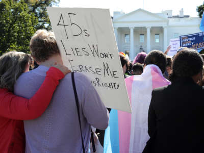 Activists from the National Center for Transgender Equality, partner organizations and their supporters hold a "We Will Not Be Erased" rally in front of the White House on October 22, 2018, in Washington, D.C.