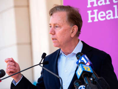 Connecticut Governor Edward Miner "Ned" Lamont Jr. speaks at Hartford HealthCare St. Vincent's Medical Center in Bridgeport, Connecticut, on February 26, 2021.
