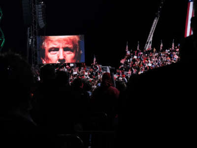 Hundreds of people attend a then-President Trump rally in support of Sen. David Perdue and Sen. Kelly Loeffler on December 5, 2020, in Valdosta, Georgia.