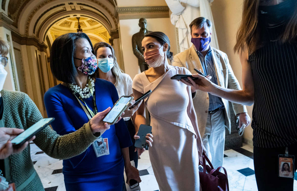 Rep. Alexandria Ocasio-Cortez walks out after a vote speaking with reporters on Capitol Hill on May 13, 2021, in Washington, D.C.