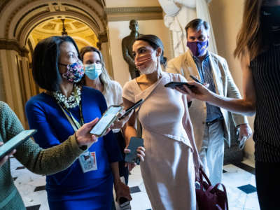 Rep. Alexandria Ocasio-Cortez walks out after a vote speaking with reporters on Capitol Hill on May 13, 2021, in Washington, D.C.