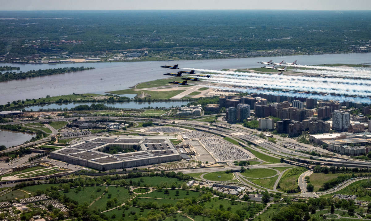 The Air Force and Navy flight demonstration squadrons, the Thunderbirds and the Blue Angels, fly over the Pentagon on May 2, 2020, as part of "America Strong," a collaborative "salute" from the two services to honor health care workers, first responders, service members and other essential personnel during the COVID-19 pandemic.