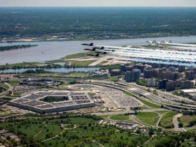 The Air Force and Navy flight demonstration squadrons, the Thunderbirds and the Blue Angels, fly over the Pentagon on May 2, 2020, as part of "America Strong," a collaborative "salute" from the two services to honor health care workers, first responders, service members and other essential personnel during the COVID-19 pandemic.