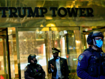 NYPD officers stand guard in front on Trump Tower on 5th Avenue the night before the Presidential Elections in New York, November 2, 2020.