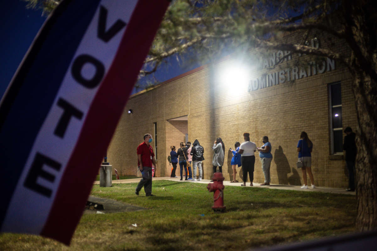 With an hour left to vote, people wait in line at Manor ISD Administration building on November 3, 2020, in Manor, Texas.