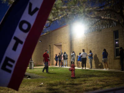 With an hour left to vote, people wait in line at Manor ISD Administration building on November 3, 2020, in Manor, Texas.