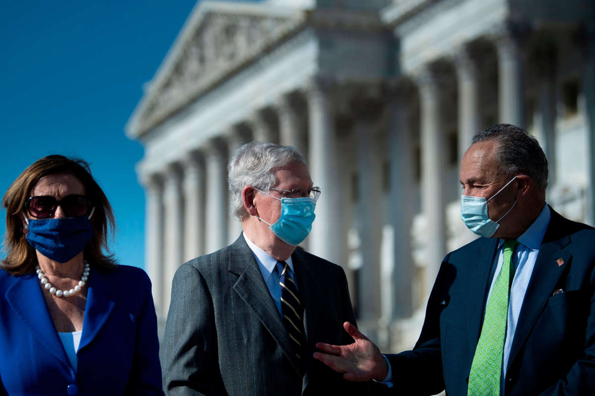 Speaker of the House Nancy Pelosi waits while Senate Majority Leader Senator Mitch McConnell and Senate Minority Leader Charles Schumer talk outside the U.S. Capitol building on July 29, 2020, in Washington, D.C.