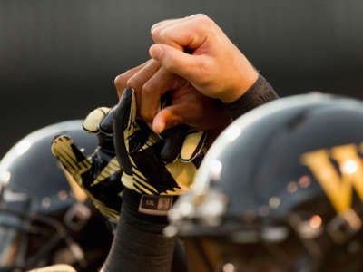 Wake Forest Demon Deacon players join hands prior to the game against the Liberty Flames at BB&T Field on September 1, 2012, in Winston Salem, North Carolina.