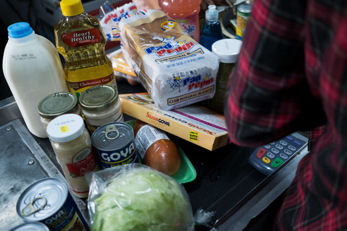 Food stamp beneficiaries do their groceries shopping at Agranel Supermarket in Bayamon, Puerto Rico, on March 20, 2019.