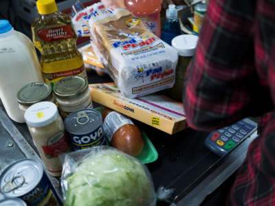 Food stamp beneficiaries do their groceries shopping at Agranel Supermarket in Bayamon, Puerto Rico, on March 20, 2019.