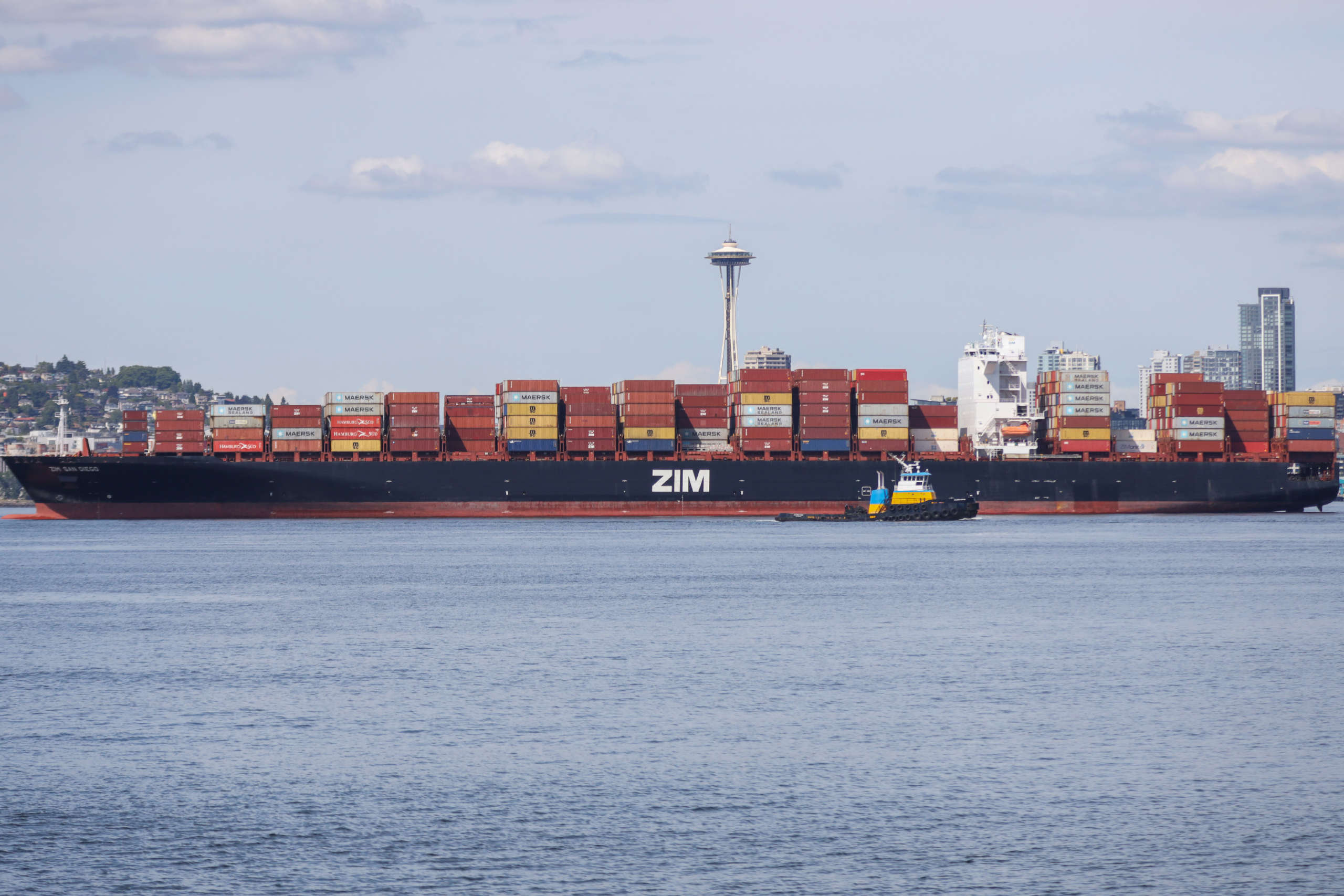 Zim San Diego awaiting to be unloaded, with Seattle’s space needle in background.