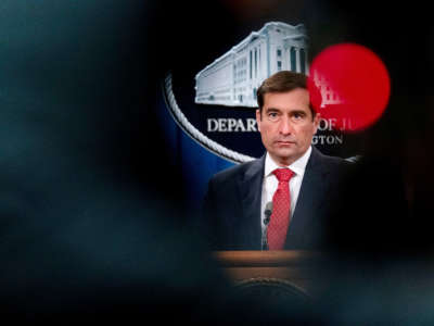 Assistant Attorney General for the National Security Division John Demers takes a question from a reporter via teleconference at a news conference at the Department of Justice, on October 19, 2020, in Washington, D.C.