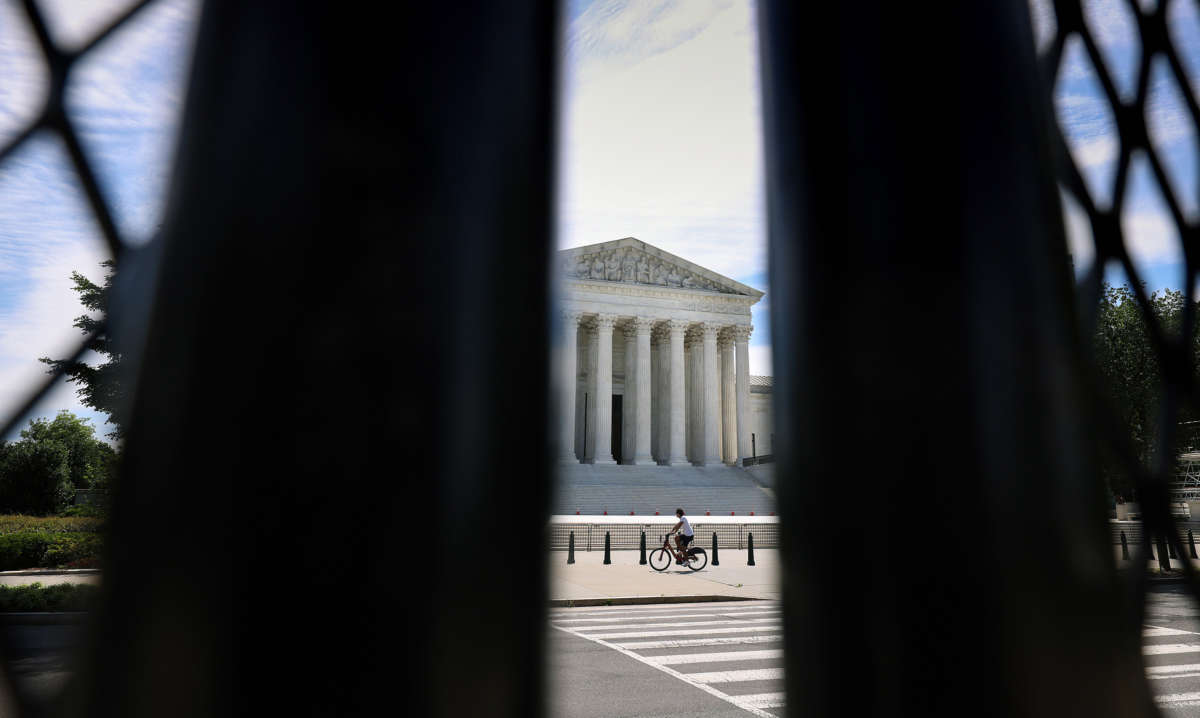 The U.S. Supreme Court is seen through security fencing on June 1, 2021, in Washington, D.C.