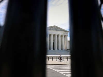 The U.S. Supreme Court is seen through security fencing on June 1, 2021, in Washington, D.C.