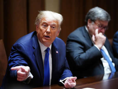 President Donald Trump, with Attorney General William Barr, speaks during a discussion in the Cabinet Room of the White House in Washington, D.C., on September 23, 2020.