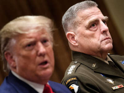 Chairman of the Joint Chiefs of Staff Army General Mark A. Milley, right, listens while President Donald Trump speaks before a meeting with senior military leaders in the Cabinet Room of the White House in Washington, D.C. on October 7, 2019.