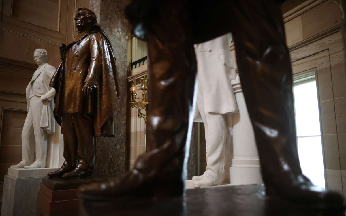 Statues of Jefferson Finis Davis, 2nd left, president of the Confederate States from 1861-1865, and Uriah M. Rose, left, an Arkansas county judge and supporter of the Confederacy, are on display in Statuary Hall inside the U.S. Capitol on June 18, 2020, in Washington, D.C.