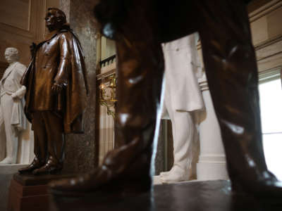 Statues of Jefferson Finis Davis, 2nd left, president of the Confederate States from 1861-1865, and Uriah M. Rose, left, an Arkansas county judge and supporter of the Confederacy, are on display in Statuary Hall inside the U.S. Capitol on June 18, 2020, in Washington, D.C.