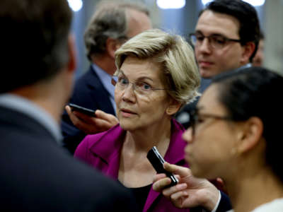 Sen. Elizabeth Warren speaks to reporters in the Senate subway during a procedural vote on June 22, 2021, in Washington, D.C.