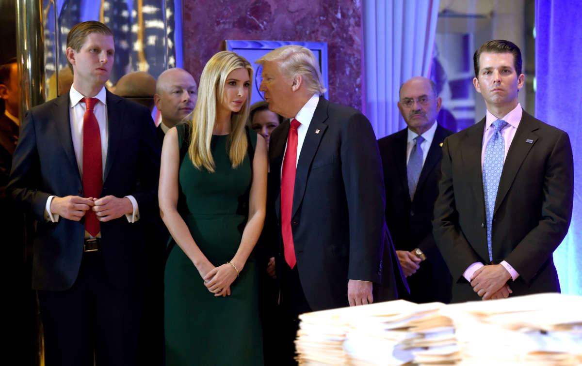 In this file photo taken on January 11, 2017, President-elect Donald Trump arrives with his children for a press conference at Trump Tower in New York, accompanied by Allen Weisselberg (2nd R), chief financial officer of The Trump Organization.