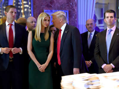 In this file photo taken on January 11, 2017, President-elect Donald Trump arrives with his children for a press conference at Trump Tower in New York, accompanied by Allen Weisselberg (2nd R), chief financial officer of The Trump Organization.