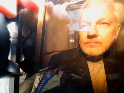 WikiLeaks founder Julian Assange arrives at court in London on May 1, 2019, to be sentenced for bail violation.