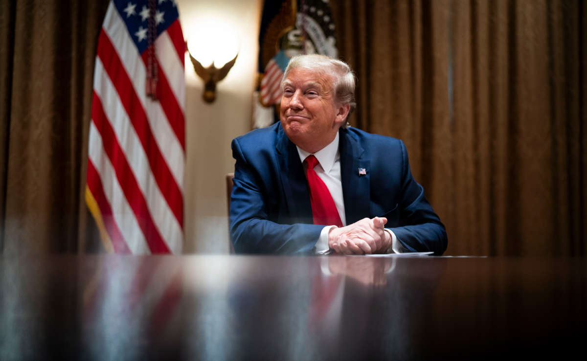 President Donald Trump listens during a meeting with healthcare executives in the Cabinet Room of the White House on April 14, 2020, in Washington, D.C.