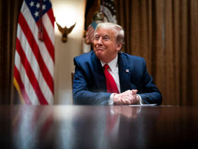 President Donald Trump listens during a meeting with healthcare executives in the Cabinet Room of the White House on April 14, 2020, in Washington, D.C.