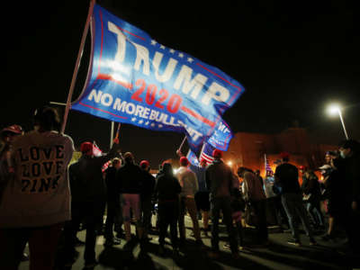 Trump supporters demonstrate at a "Stop the Steal" rally in front of the Maricopa County Elections Department office on November 7, 2020, in Phoenix, Arizona.