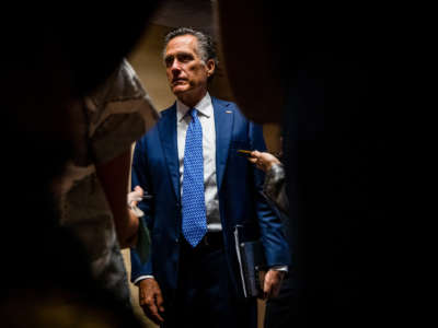 Sen. Mitt Romney talks to reporters as he leaves a bipartisan meeting on infrastructure in the basement of the U.S. Capitol building on June 8, 2021, in Washington, D.C.