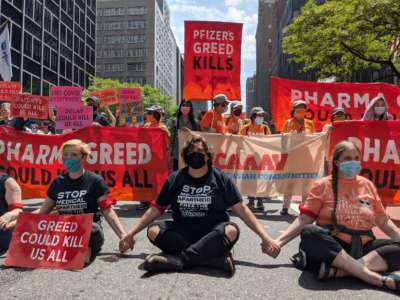 Priscilla Robinson (middle) takes part in a collective blockade outside the Pfizer headquarters on E. 42nd Street in New York City on July 14 to demand that Big Pharma stop prioritizing profits over global access to COVID-19 vaccines.