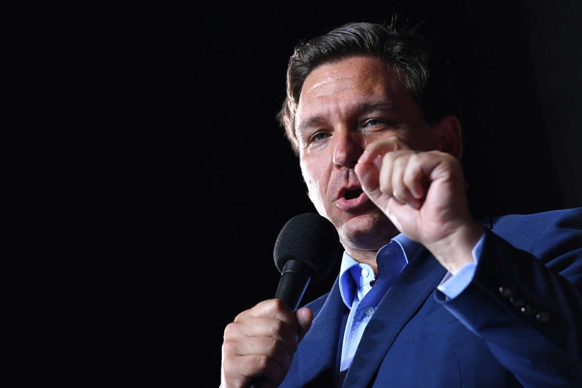 Florida Gov. Ron DeSantis gestures as he speaks during a campaign rally at Pensacola International Airport in Pensacola, Florida, on October 23, 2020.