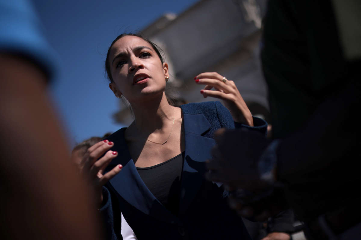 Rep. Alexandria Ocasio-Cortez speaks with supporters during an event outside Union Station on June 16, 2021, in Washington, D.C.