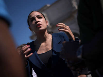 Rep. Alexandria Ocasio-Cortez speaks with supporters during an event outside Union Station on June 16, 2021, in Washington, D.C.