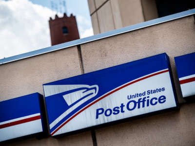 A sign outside the USPS Baltimore Processing and Distribution Center is pictured in Baltimore, Maryland, on August 17, 2020.