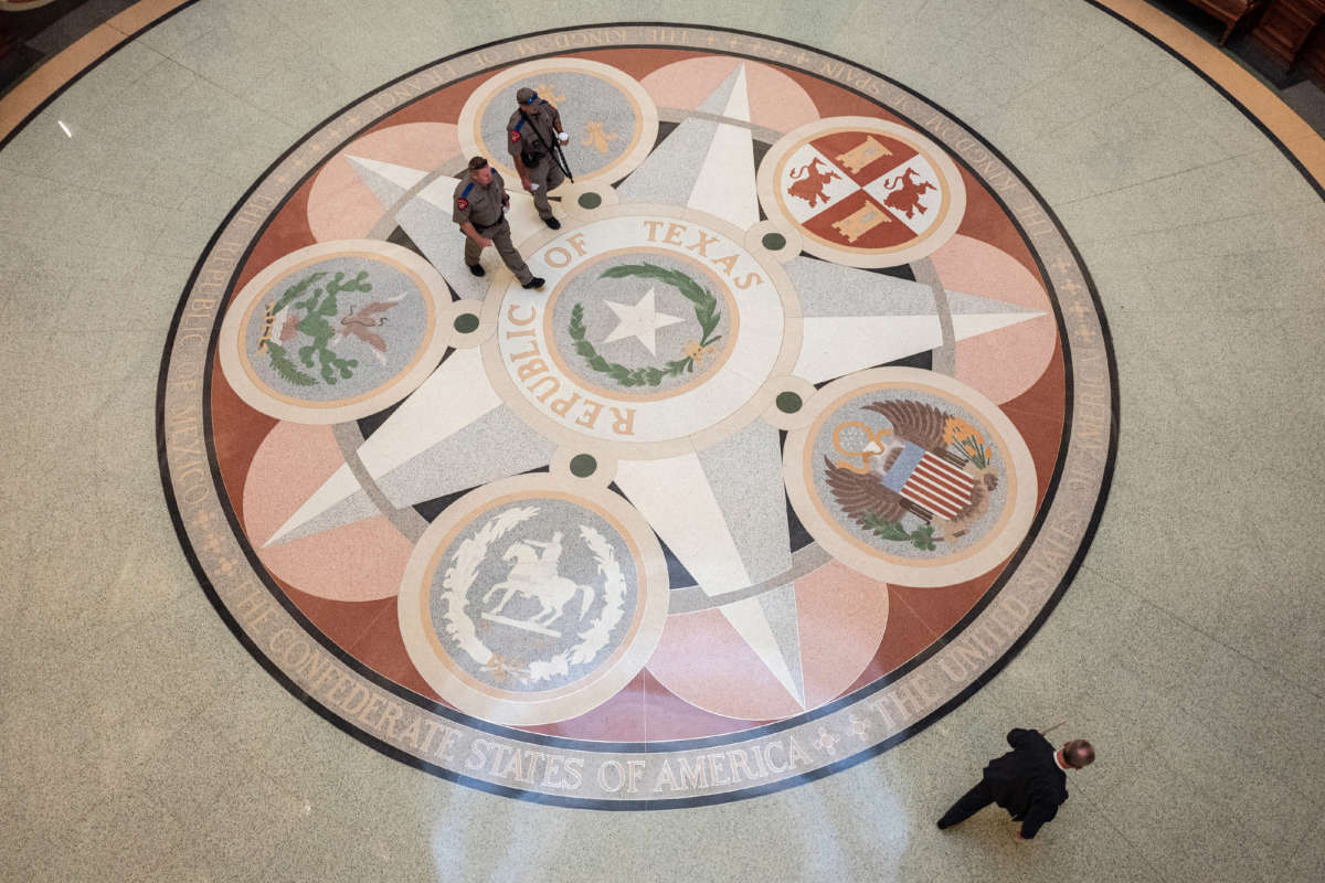 People walk through the rotunda of the Texas State Capitol on the first day of the 87th Legislative Special Session on July 8, 2021, in Austin, Texas.