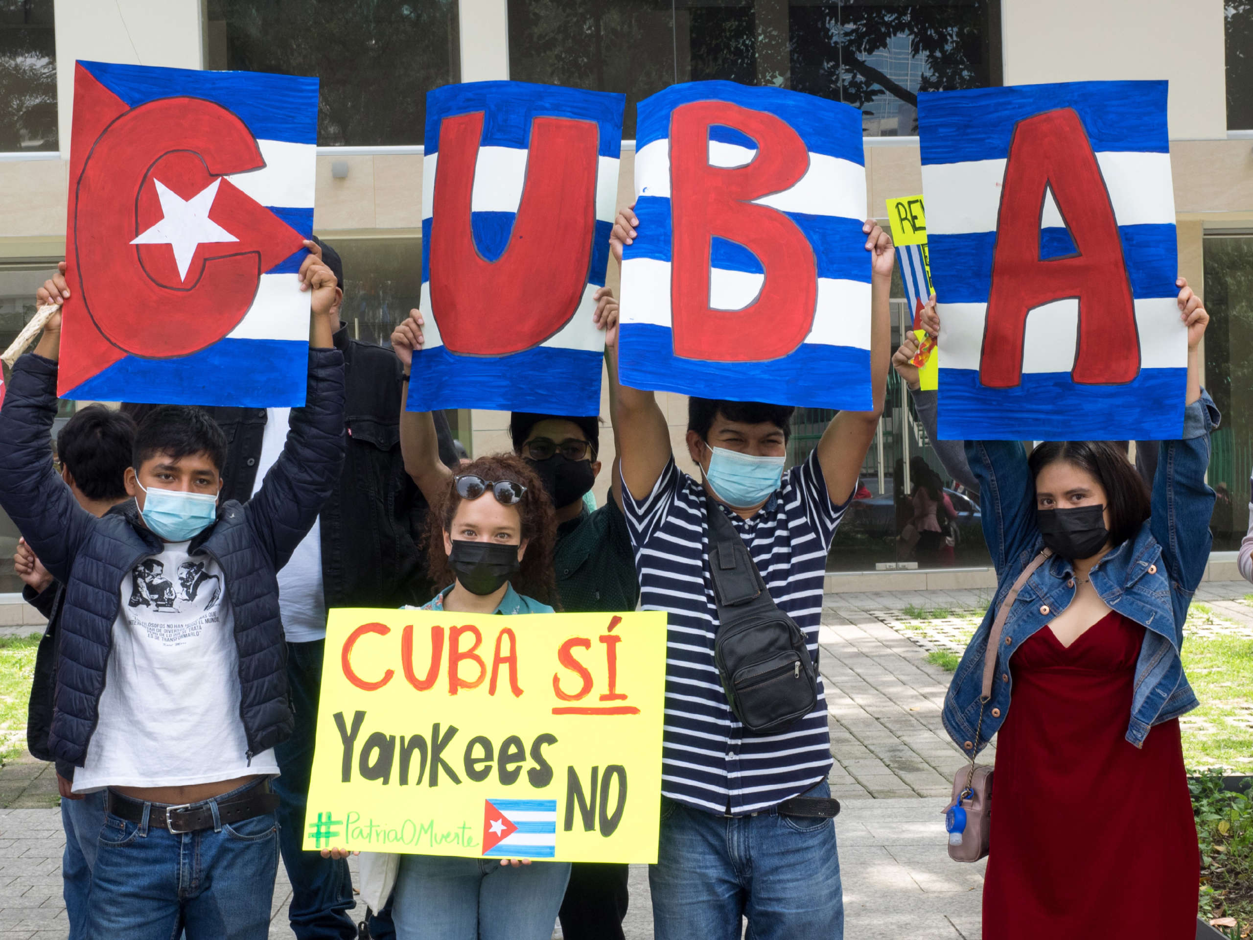 Students from the National Federation of Revolutionary Students demonstrate in support of the Cuban Revolution near the Cuban embassy in Mexico City, Mexico, July 17, 2021.