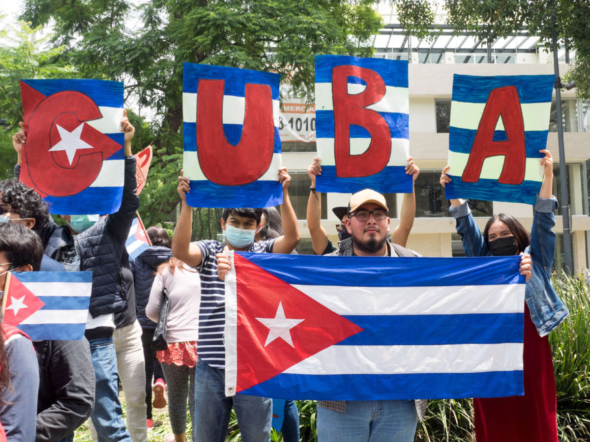 Students demonstrate their support for the Cuban Revolution in front of the Cuban embassy in Mexico City, Mexico, July 17, 2021.